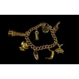 A 9ct Gold Albert Chain with Padlock Loaded with 7 Good Quality 9ct Gold Charms. All Links Marked