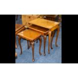 Nest of Three Tables With Glass Tops made in Maple wood veneer with carved edges and tapered feet.