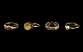 A Collection of 4 9ct Gold Rings one set with a seed pearl, a paste set full eternity, a diamond