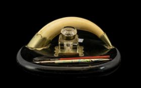 Early 20thC Ink Stand Nickel Plated Mounted Boars Tusk On A Black Oval Base With Glass Inkwell And