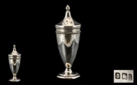 An Art Deco Silver Sugar Castor of conical form with a pierced top. Hallmarked for Birmingham Q-