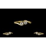 18ct Gold - Attractive Two Stone Diamond Set Twist Ring. The cushion cut diamonds of excellent