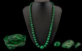 A Mixed Lot of Malachite to include a small ash tray, an egg, a graduated bead necklace plus one