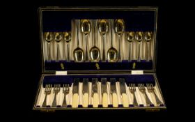 Boxed Canteen of Silver Plated Cutlery in original leather bound box lined in violet velvet.