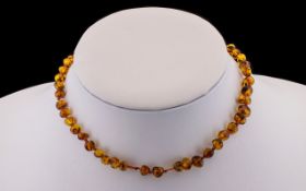 Early 20thC Small Free Form Polished Amber Choker Necklace 14 inches in length including clasp.