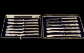 Two Sets of Cased Silver Handled Butter Knives. Complete with Silk lined Fitted Cases.