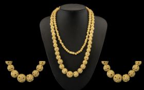 A Carved Bone Graduated Bead Necklace, early 20thC and beads ranging from 6 mm to 14 mm. The