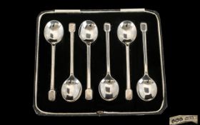 A Set of Six Art Deco Boxed Silver Coffee Spoons of plain modernist form. Hallmarked for Sheffield Q