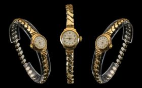 Laddies 9ct Gold Cased Watch. Laddies hall marked gold mechanical wrist watch with expandable gold