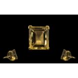 A Superb and Impressive Large Step Cut Topaz Set In a Gold Shank, with Diamond shoulders. The