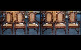 A Set of Six Modern Mahogany Carver Chairs with rush seats and backs and barley twist supports.