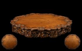 Early 20thC Georgian Style Mahogany Lazy Susan with a shaped and carved edge with scroll and shell