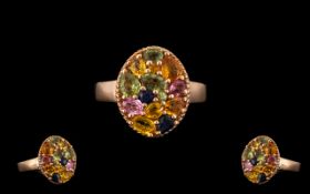 Multi Colours of Sapphire Cluster Ring, a variety of oval, round and pear cut sapphires in green,