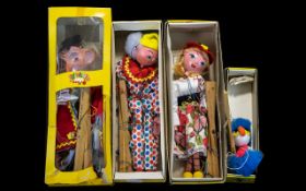 Four Boxed Pelham Puppets 'Mitzi' J568, 'Ostrich' J538, 'Wizard SL20, and 'Clown' J575.