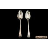 Two Georgian Silver Table Spoons both hallmarked for London O- 1809. Makers mark TN. Length 8.