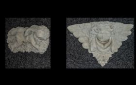 Pair of Stone Cherub's - small cherub lying on a bed of grapes and a wall mounted plaque of a