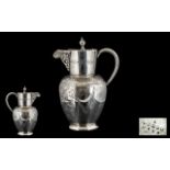 Ornate Engraved Silver Plated Water Jug with hinged lid and handle.
