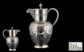 Ornate Engraved Silver Plated Water Jug with hinged lid and handle.