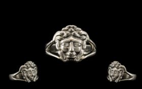 A Platinum Designer Dress Ring in a Versace Style. Depicting Medusa with diamond set eyes.