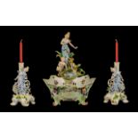 Saxony Figural Centrepiece Garniture, comprising a female figure, accompanied by a putto,