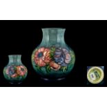 Moorcroft - Contemporary Designed Tube lined Globular Shaped Vase ' Anemone ' Design on a Blue