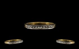 18ct Gold Half Eternity Ring set with round cut diamonds. Stamped 750. Ring size O.