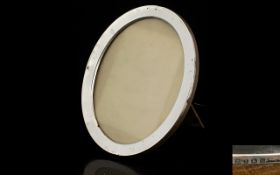 Large Silver Photo Frame. Hall Marked Birmingham 1921, of oval form, oak backed, 9 inches high,