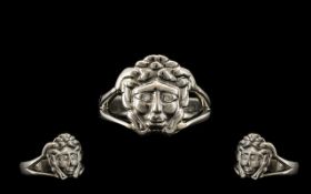 A Platinum Designer Dress Ring in a Versace Style. Depicting Medusa with diamond set eyes. Fully