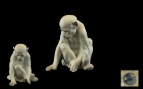 Heubach Gebruder Late 19thC White Porcelain Figure of a Monkey staring down on a small insect to his