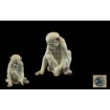 Heubach Gebruder Late 19thC White Porcelain Figure of a Monkey staring down on a small insect to his