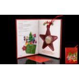 Disney Christmas Decoration Limited Edition 1/2 oz Silver Coin in red collector's book. 999 Fine