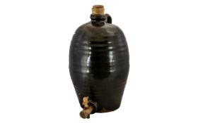 A Stoneware Green Glazed Cider Barrel with wooden stopper and tap. Height 148 inches. A/F