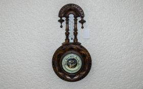 1920's Well Carved - Nice Quality Walnut Cased Wall Hanging Android Barometer with Porcelain Chapter