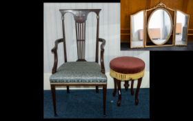 A Victorian Mahogany Piano Stool with a dusky pink padded seat and gold fringing and raised on