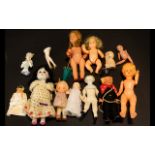 Collection of Small and Miniature Bisque, Plastic and Celluloid Dolls, including a Japanese Futamara