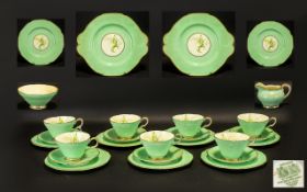 Paragon Part Dinner Service in pale green bone china with floral relief and gilt trim. Comprises 7