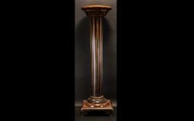 A Mahogany Fluted Column with a circular stepped and square base, Measuring 35 inches in height.