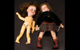 Two Armand Marseille Bisque Head Dolls, one in original Scottish attire, marked Armand Marseille,