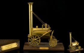 Train Interest. Scratch built model of Stephensons Rocket, made of brass on wooden plinth, 10 1/2