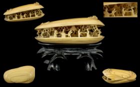 Japanese - 19th Century Wonderful Carved Ivory Clam Shell with Figures Raised on a Carved Wooden