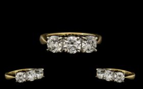 18ct Gold and Platinum Set 3 Stone Diamond Ring of Superb Quality. Marked 750 - 18ct.