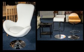 A Modern Contemporary Swivel Chair in Cream Leatherette on a chrome circular frame. Together with