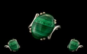 Malachite Solitaire Ring, a 16ct oval cut cabochon of the distinctive green stone, malachite, here