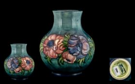 Moorcroft - Contemporary Design Tubelined Globular Shaped Vase ' Anemone ' Design on a Blue Ground.