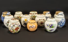 Collection of Lidded Ginger Jars comprising jars by Arthur Wood, Sadler and Carlton Ware, and the