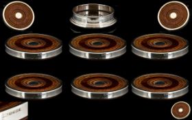 A Fine Quality Contemporary Designed Set of ( 7 ) Sterling Silver Wine Coasters - With Mahogany and