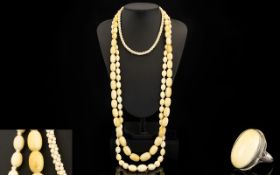 Early 20th Century Carved Ivory Graduated Beaded Necklaces ( 2 ) Necklaces of Long Length. c.