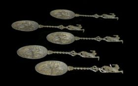 Five Dutch Pewter Decorative Spoons Each with figural design embossed bowl,