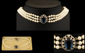 Three Strand Pearl Choker with central blue stone with filigree surround. All housed in blue