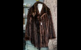 Ladies Mink Jacket. Hip length, hook and eye fastening, two slit pockets, revere collar and long